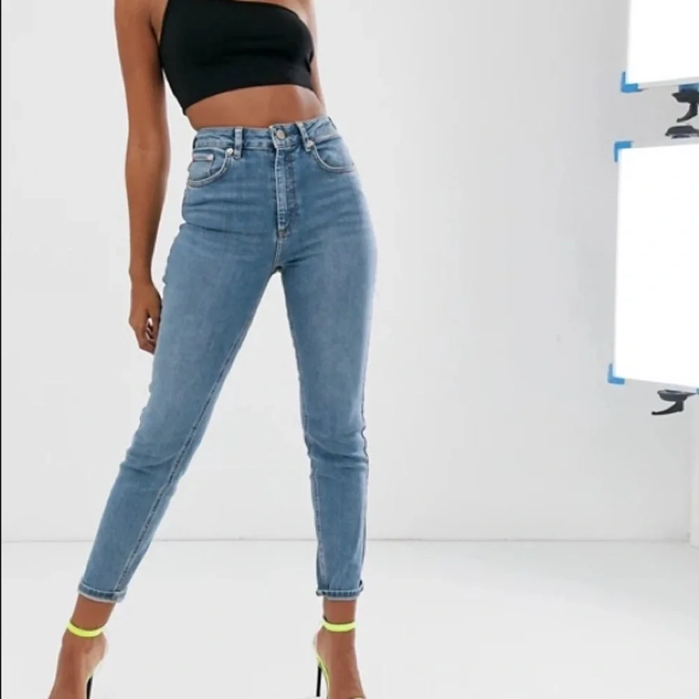ASOSHigh waisted Bum Ripped jeans